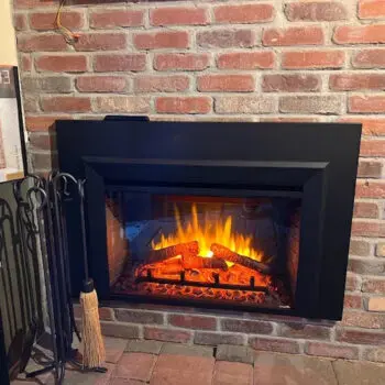 Electric fireplace in brick wall