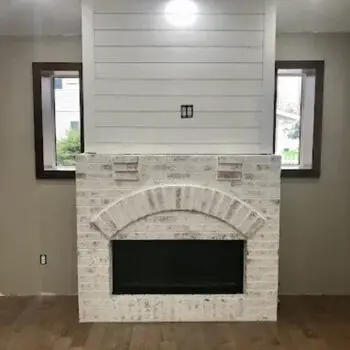 White brick modern fireplace installation