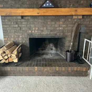 Brick fireplace with wood logs