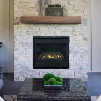 Stone fireplace cozy seating arrangement