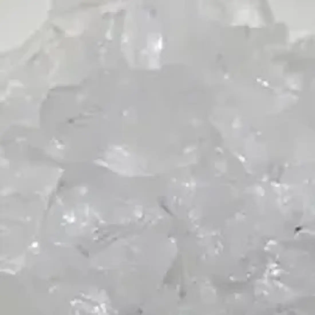Clear ice cube pile closeup