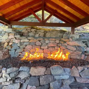 Stone fireplace with burning flames