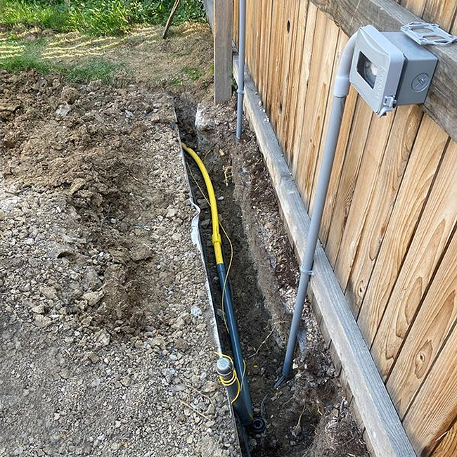 Gas line installation trench backyard